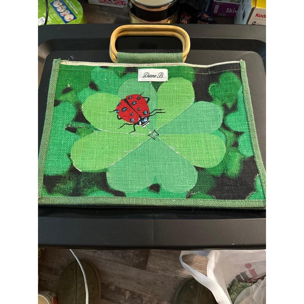 Diane B tote wih green clover and a ladybug